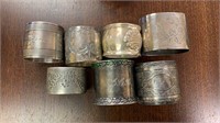 7 Silver Victorian napkin rings, one is clearly