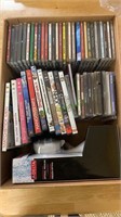 Box lot of 11 movie DVDs, 40 music CDs and a new