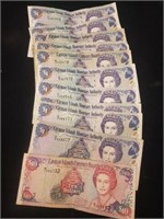 11)Cayman Island dollars & 1) $10bill