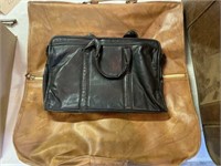 Black leather briefcase with brown traveling bag