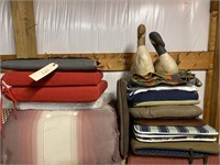 Shelf with cushions, blankets, pillow geese