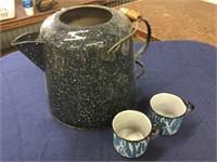 Large granite coffee pot and two enamelware cups,