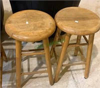 Two small oak barstools, seat tops could be