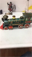 Tin toy locomotive “very nice”