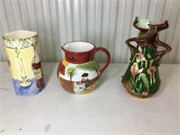 1 ceramic pitcher 7.5” tall and 2 ceramic vases