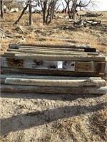 Pile of Wood Posts and Railroad Ties