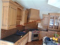 Kitchen counter/cabinets w/ stove hood & sink...