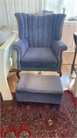 Blue wing back chair with cabrio legs with a