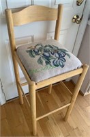 Plum upholstered barstools with a foot rail