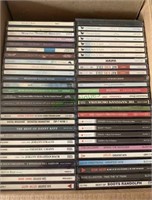 Box lot of 55 music CDs. Sold where is, as is