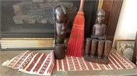 Two carved wooden African figures, a whisk broom,
