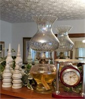 Chess pieces, oil lamp and clock
