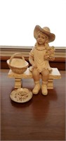 Little girl on a bench statue and small plate