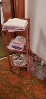 3 tier wicker shelf and contents