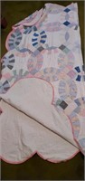 Handmade wedding ring quilt in used condition