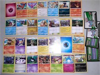Lot of 28 Pokemon cards plus 4 code cards