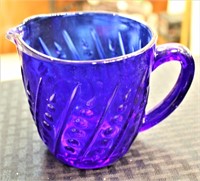 Blue glass measuring cup