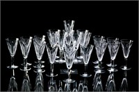 TWENTY-FOUR WATERFORD FLUTED CHAMPAGNE GLASSES