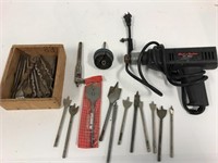 Spade bits. Hole saw set. Drill. Works