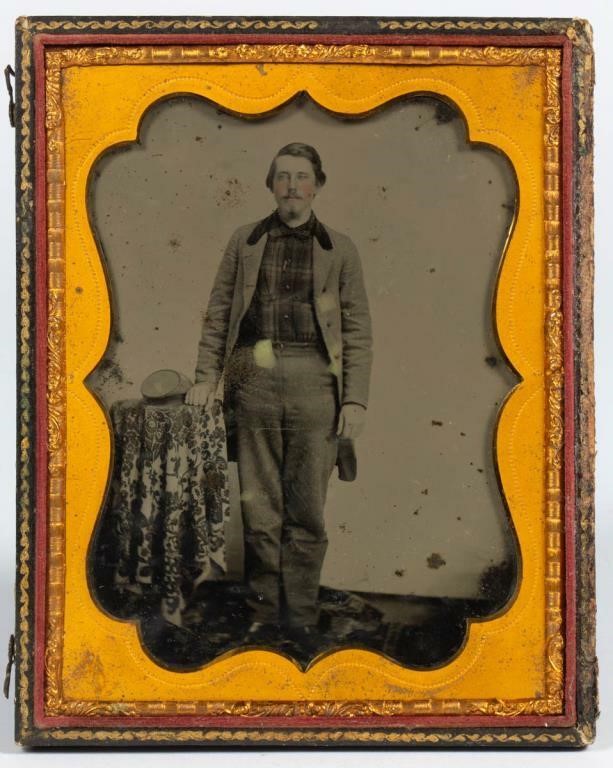 Rare half-plate ambrotype of a young man with kepi, probably a Confederate soldier wearing a home-made uniform