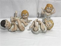 4 Porcelain Piano Babies