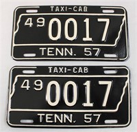 Pair of black 1957 TN taxi tags