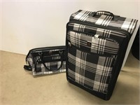 Large suitcase on wheels and matching carry on