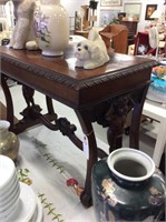 Antique side table with cherubs