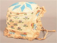 19th Century Infant's Knit and Beadwork Bonnet.