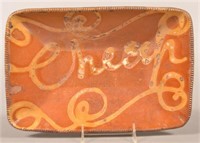 Yellow Slip-Decorated "Cheap" Redware Loaf Dish.