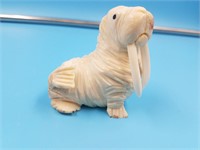 Ivory carving of a walrus by Dennis Pungowiyi with