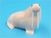 Ivory carving of a walrus with baleen inset eyes,