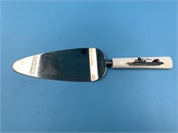 Cake spoon with scrimshawed ivory handle of hunter
