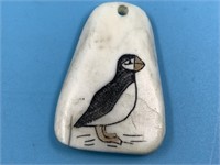 Scrimshawed ivory pendant depicting a puffin, pend