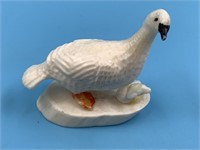 Ivory carving of a tern with a chick hatching from