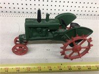 Vintage cast iron tractor on steel wheels