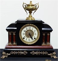 WOODEN MANTLE CLOCK WITH BRASS URN TOP