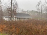 1 +/- acre with older home on Rasberry Ln Deville