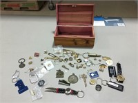Norbert’s Collection of Keychains, Pins, Tie