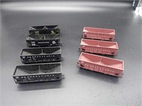 7 assorted empty 32' hoppers HO Scale