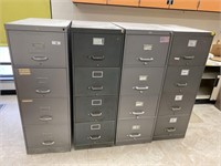 4 industrial metal filing cabinets.