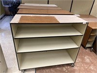 4 commercial grade wheeled book shelves.