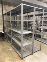 5 industrial metal shelving units.