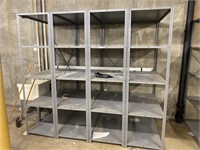 4 industrial metal shelving units.
