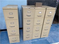 4 metal filing cabinets.