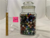 Glass jar full of coloured marbles