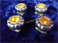 Four Silvertone Candle Holders