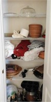 Contents of bathroom closet to include baskets,