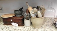 Stone mortar and pestle, wooden bread tray,