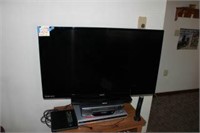 TV, VCR, DVD player, and stand